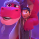 A giant pink and purple dragon puts his arms around a man in a suit.